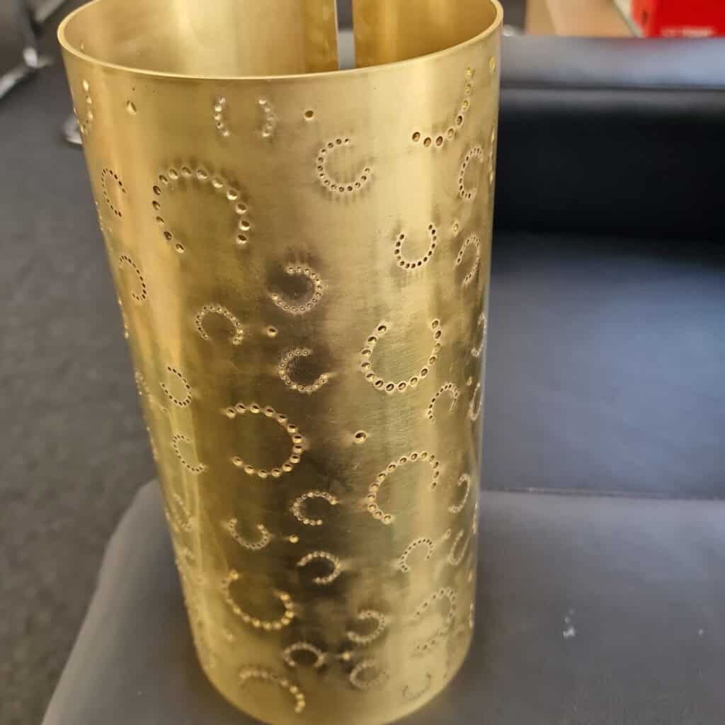 Perforated laser cut brass lamp shade rolled from sheet metal